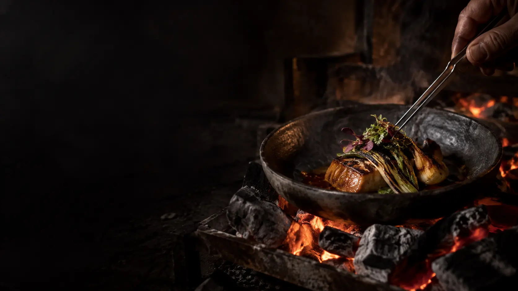 Seasonal tasting dish finished over glowing coals